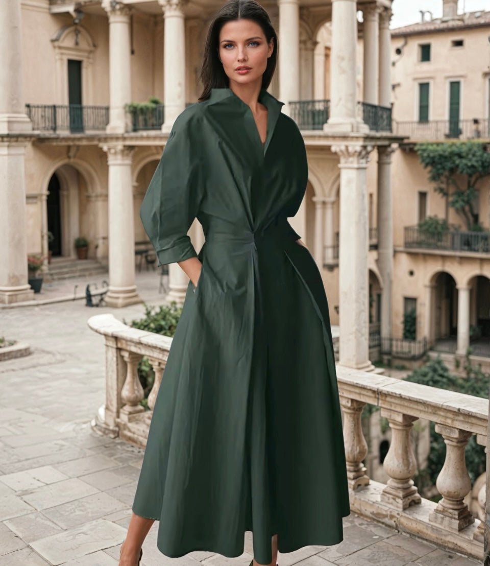 Vestido midi elegante de línea amplia con cuello alto y mangas tres cuartos