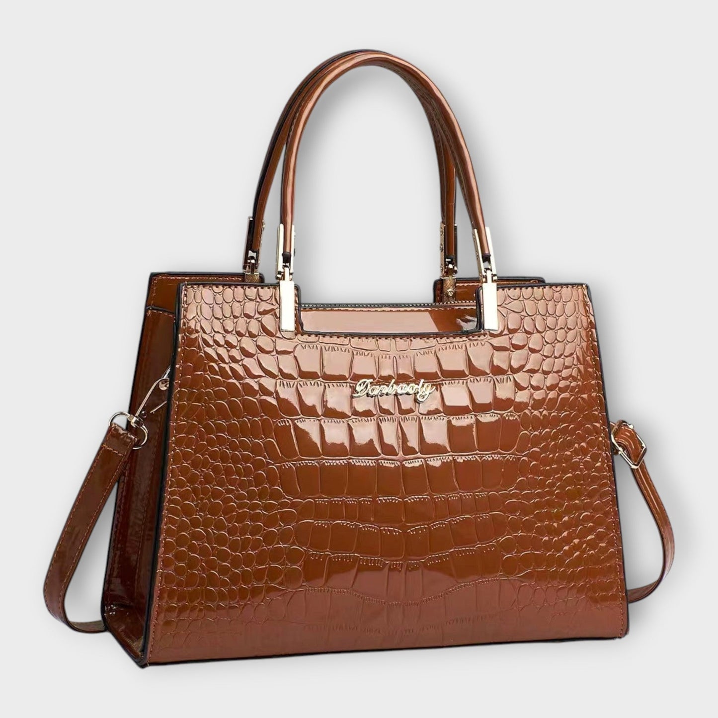 Rita. – Bolso de mano efecto cocodrilo brillante