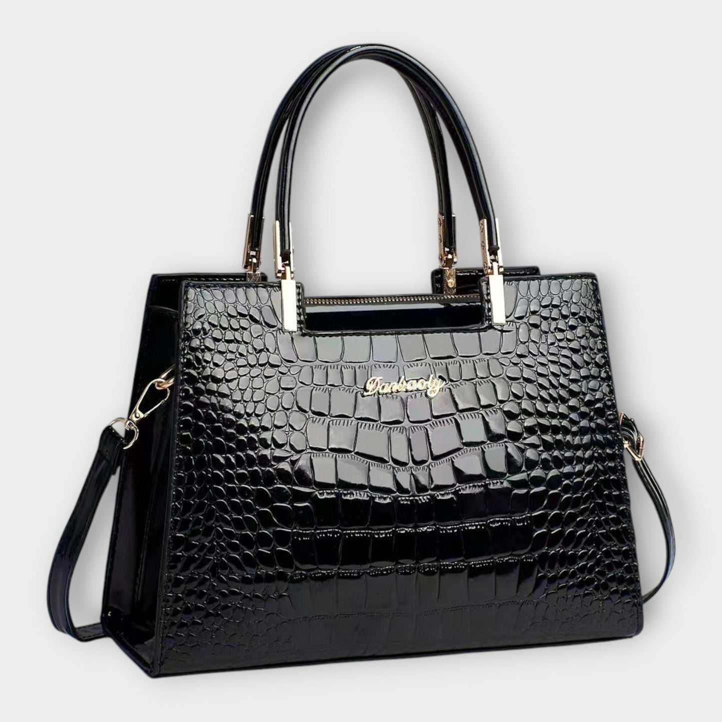 Rita. – Bolso de mano efecto cocodrilo brillante