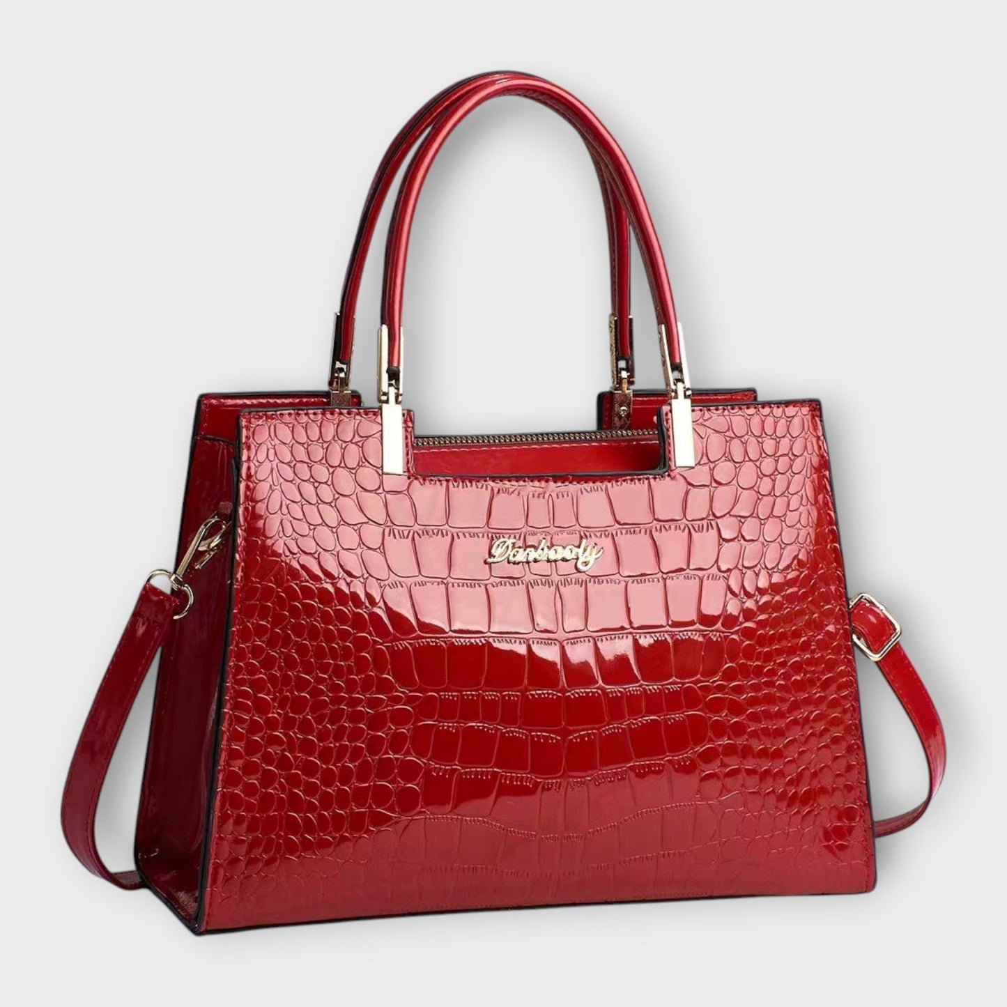 Rita. – Bolso de mano efecto cocodrilo brillante