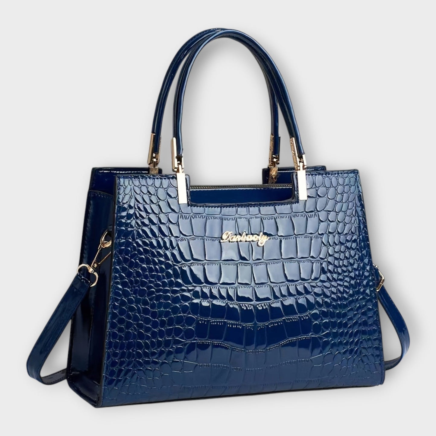 Rita. – Bolso de mano efecto cocodrilo brillante