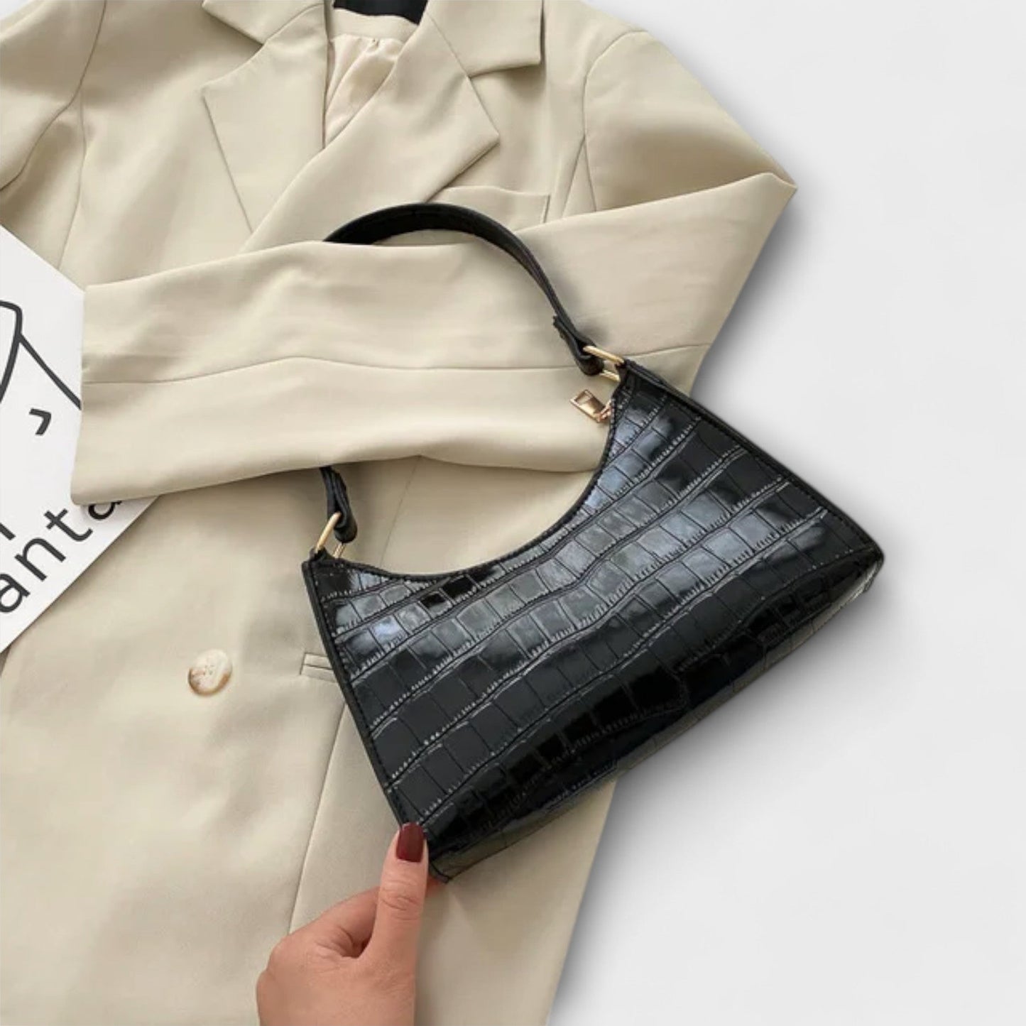 Rita. – Bolso de cuero brillante