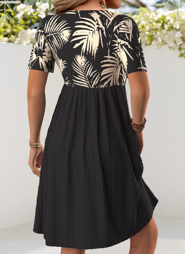 Vestido corto negro con escote en V y estampado de hojas