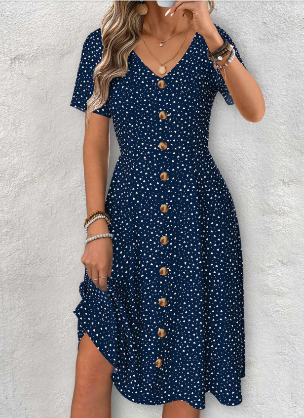 Vestido azul marino con mangas cortas, escote en V y estampado de lunares
