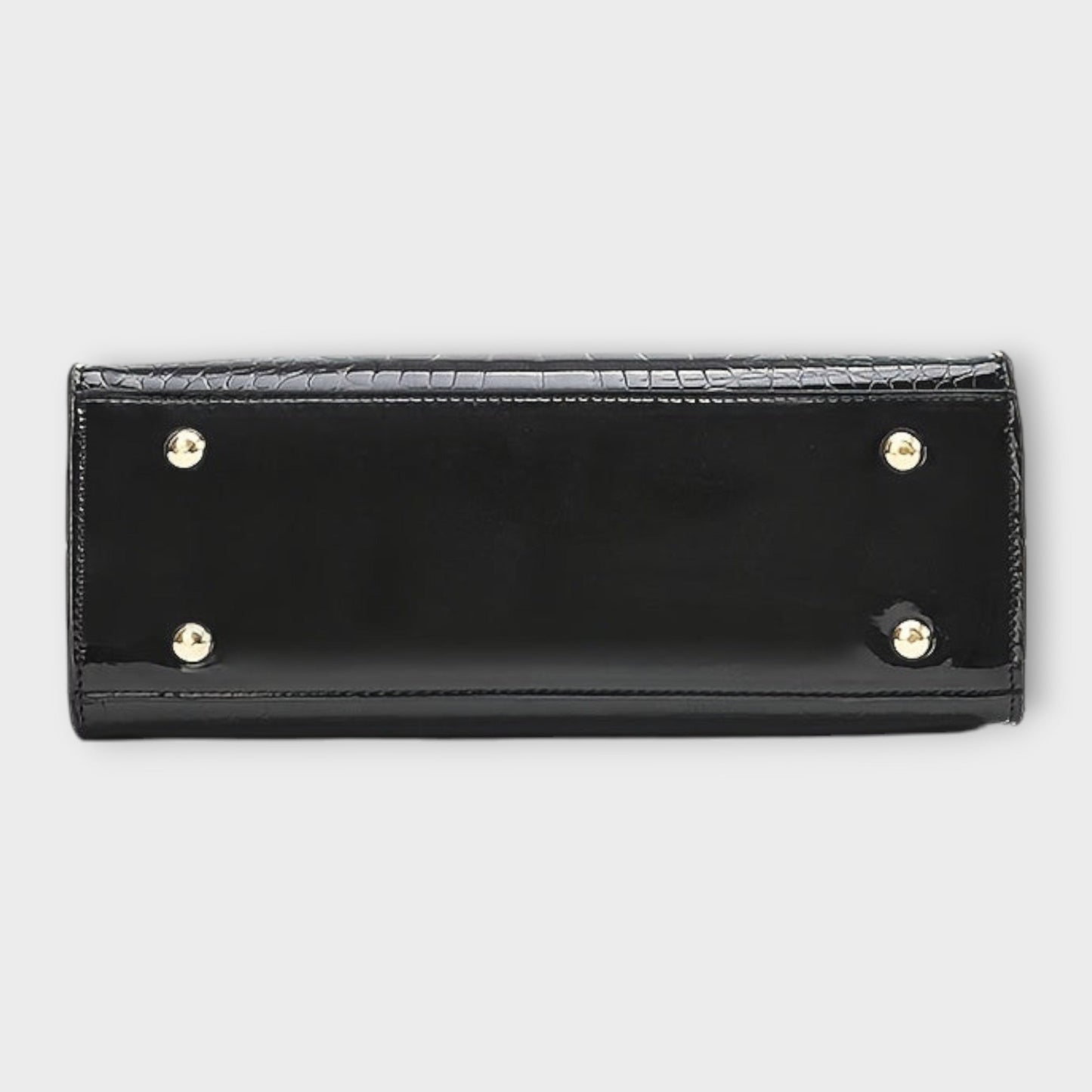 Rita. – Bolso de mano efecto cocodrilo brillante