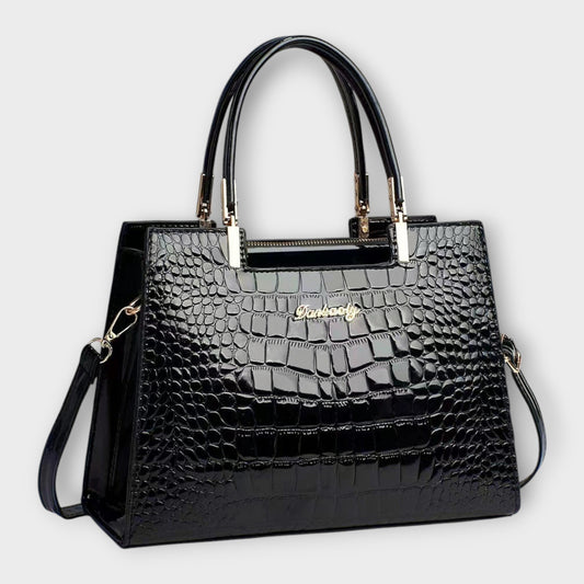 Rita. – Bolso de mano efecto cocodrilo brillante