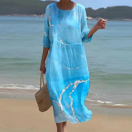Vestido largo veraniego con estampado moderno y mangas cortas