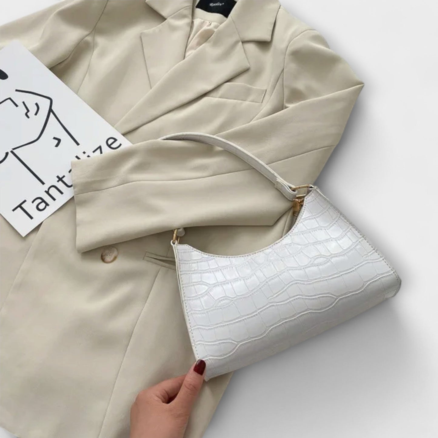 Rita. – Bolso de cuero brillante