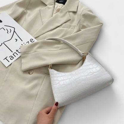 Rita. – Bolso de cuero brillante
