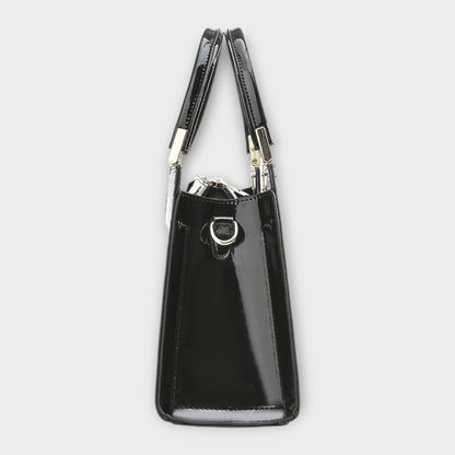 Rita. – Bolso de mano efecto cocodrilo brillante